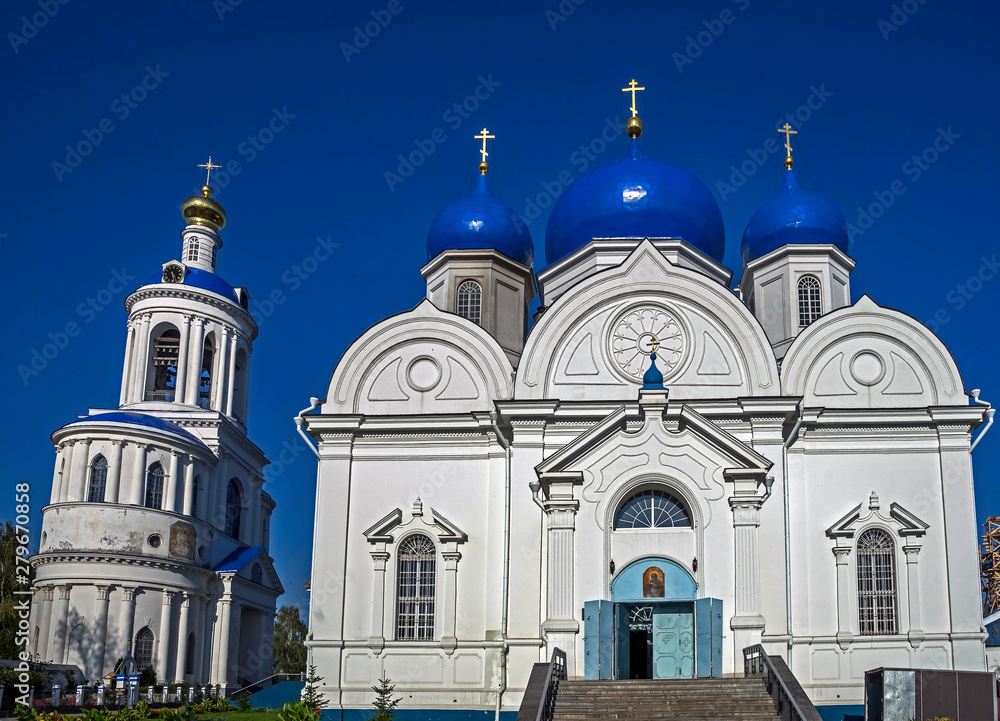 Fototapeta premium Cathedral temple and bell tower of Bogolubovo monastery. Village of Bogolubovo, Russia. Years of construction 1855 - 1856