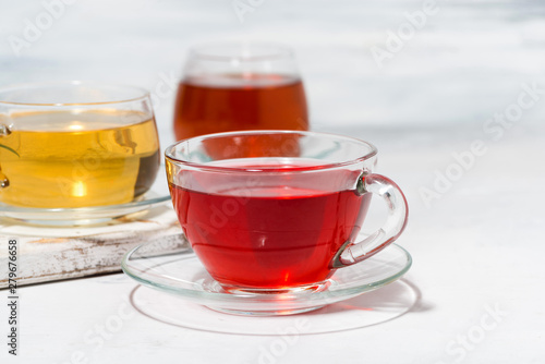 assortment of tea in glass cups on white background, closeup