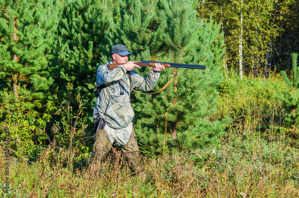 Hunter in the summer forest