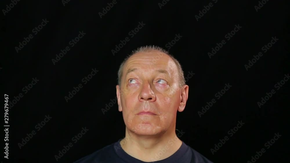 A man does eye exercises by looking from corner to corner A man does eye exercises by looking from corner to corner