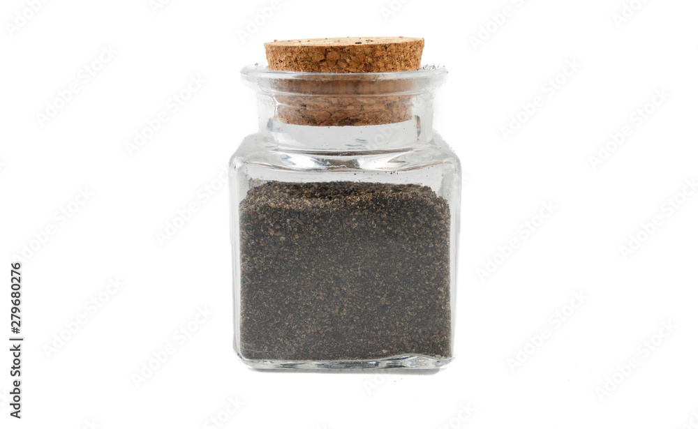 ground or milled nigella in glass jar on isolated on white background. front view. spices and food ingredients. ground or milled nigella in glass jar on isolated on white background. front view. spices and food ingredients.
