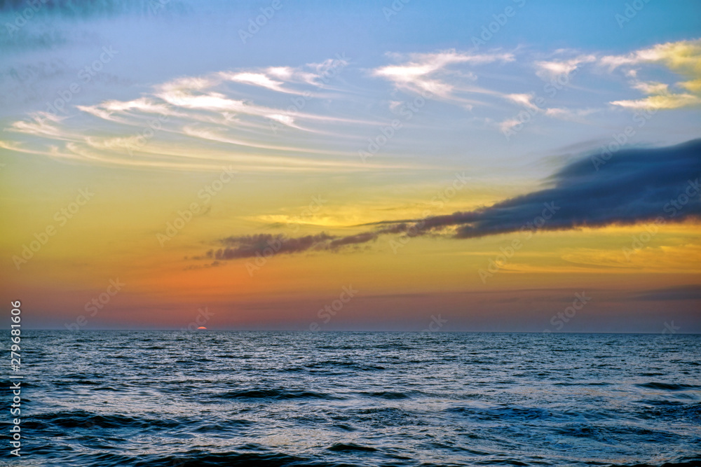Sliver of Sun on the Horizon over Ocean