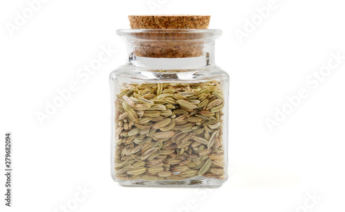 fennel seeds in glass  jar on isolated on white background. front view. spices and food ingredients.