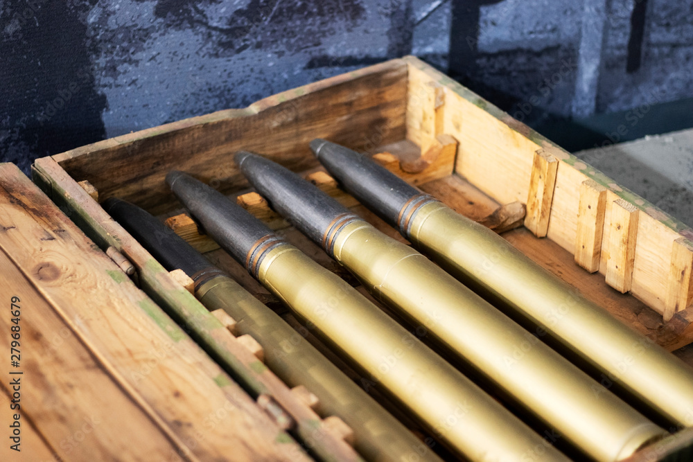 Obraz premium Shells from the gun are in the box. New ammunition arsenal in a box.