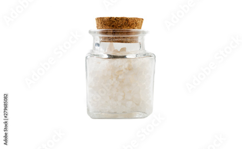 white salt crystals in glass  jar on isolated on white background. front view. spices and food ingredients.