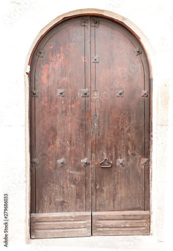 Old wooden door with gates © Jmorante