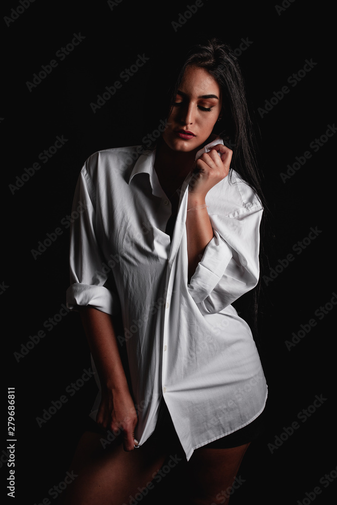 Sensual chica con camisa hombre Stock Photo | Adobe Stock
