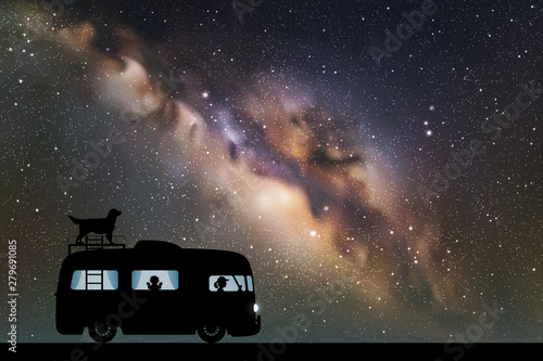 Cartoon retro car on road at night. Vector illustration with silhouettes of people and dog traveling in camper. Family road trip. Space dark background with starry sky and Milky Way
