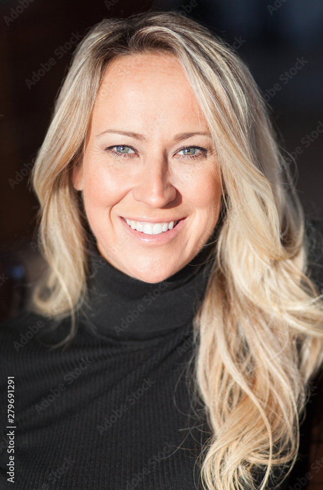 Portrait of a blonde pretty nice woman. She is confident and passionate Portrait of a blonde pretty nice woman. She is confident and passionate