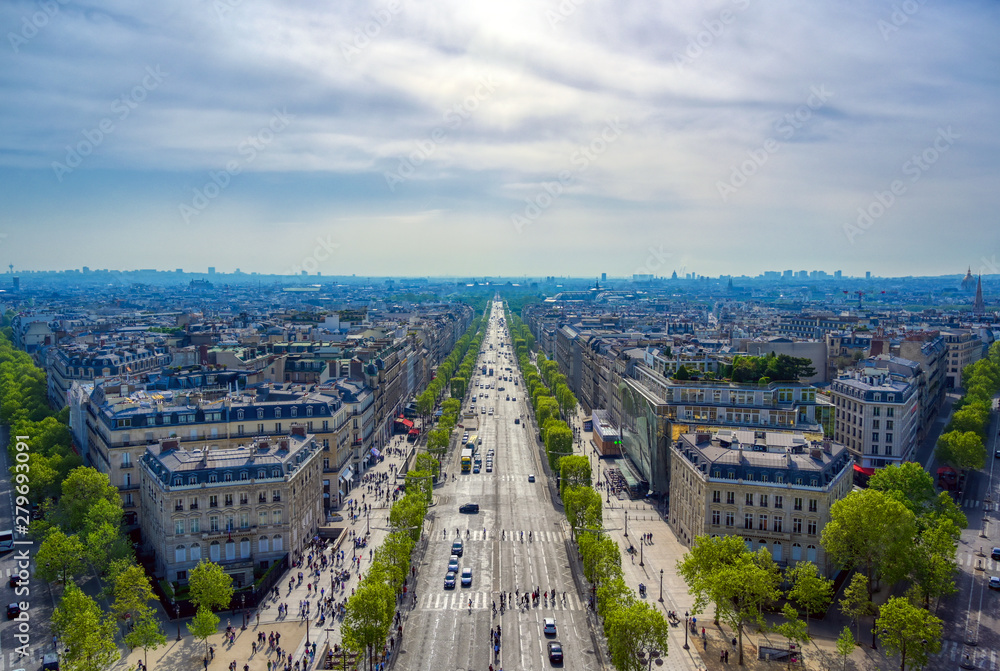 A view of Paris, France from the Arc de Triomphe on a sunny day.