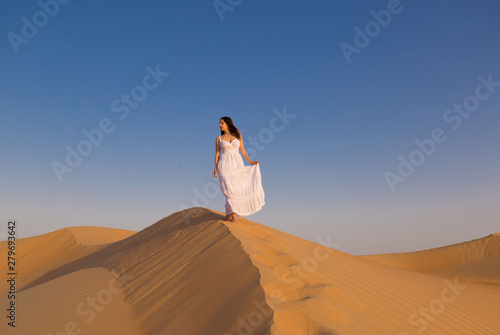 UAE. Woman in desert