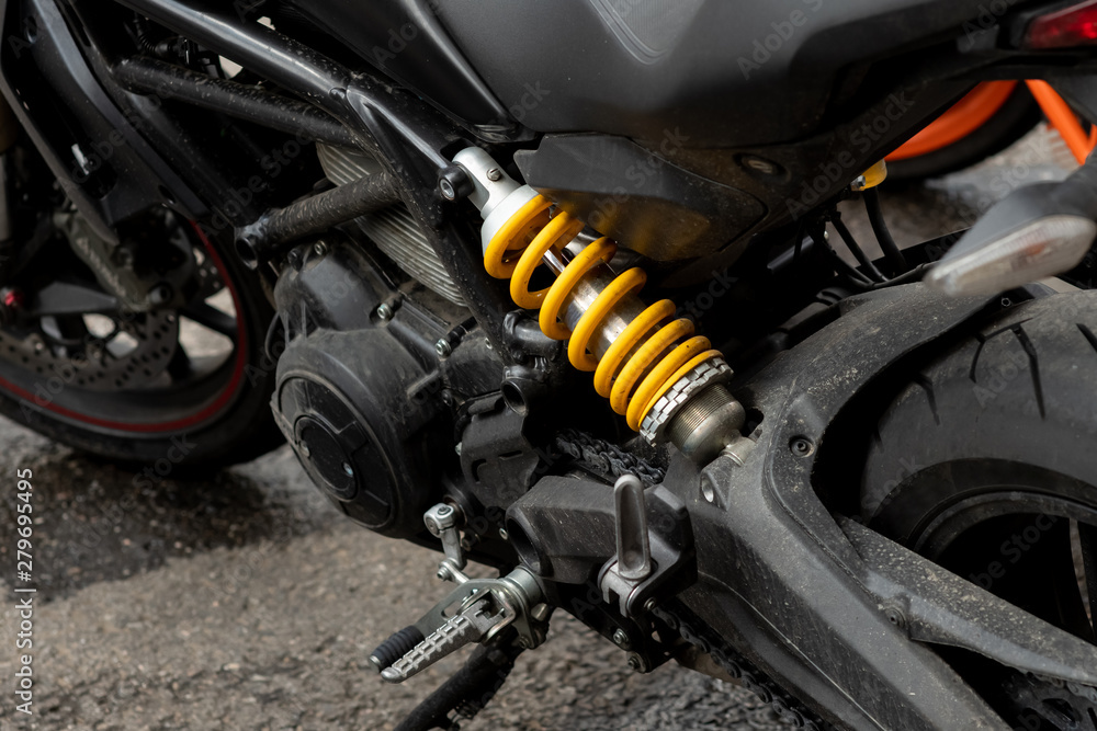 Naklejka premium Spring dampers yellow dirty black motorcycle