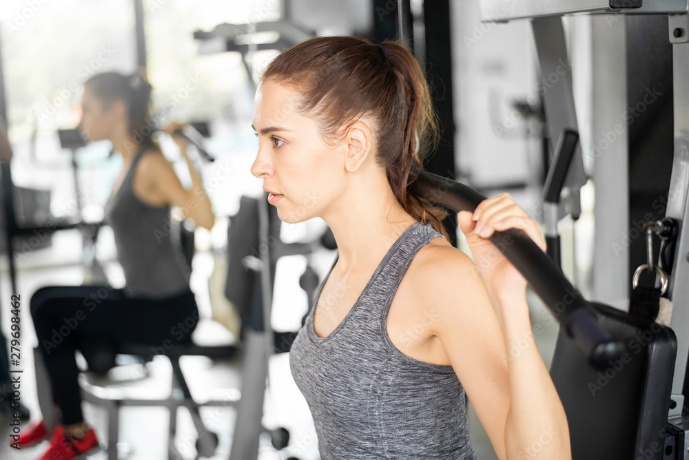 Pretty young sport woman is Workout in gym, Healthy lifestyle Pretty young sport woman is Workout in gym, Healthy lifestyle