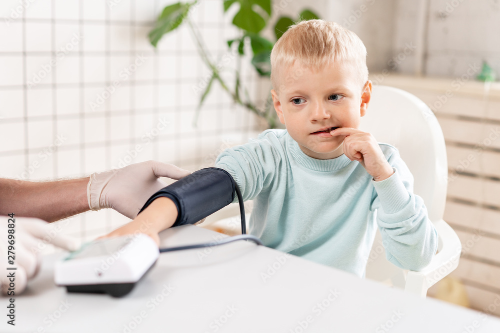 custom made wallpaper toronto digitalDoctor measuring blood pressure of a little boy. Diagnostic, healthcare, medical service. Doctor pediatrician concept