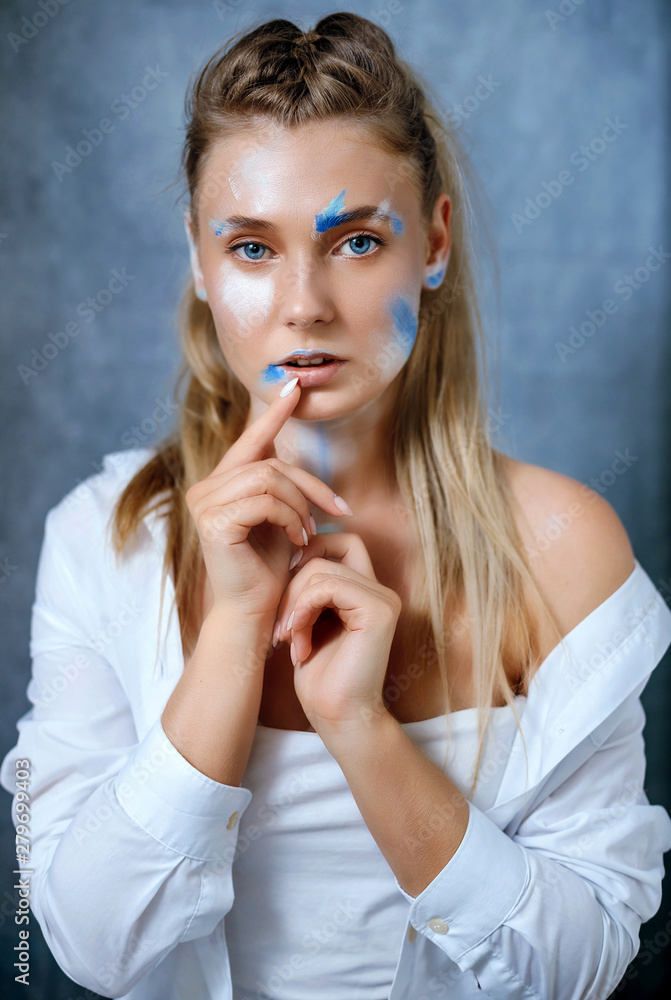 Creative fashion beauty portrait of beautiful young blonde woman with hairstyle.