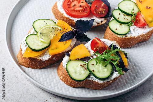 Sandwiches with cream cheese and vegetables.