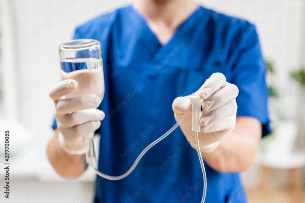 custom made wallpaper toronto digitalMedical treatment emergency concept. Doctor in blue uniform holding drip iv and infusion pump, . Intravenous fluid for seriously patient in the emergency room at hospital.