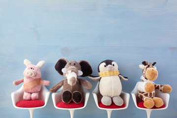 Pediatrician. Toy animals sitting on the chair in hospital. Health center for children.