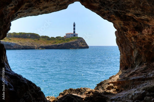 rock window with lighthouse - Porto Colom Mallorca Balearic Islands Spain