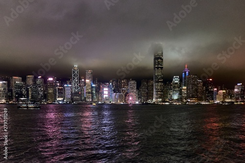 Wallpaper Mural Hong Kong, Victoria harbour - skyline with skyscrapers in the night, cloudy sky Torontodigital.ca