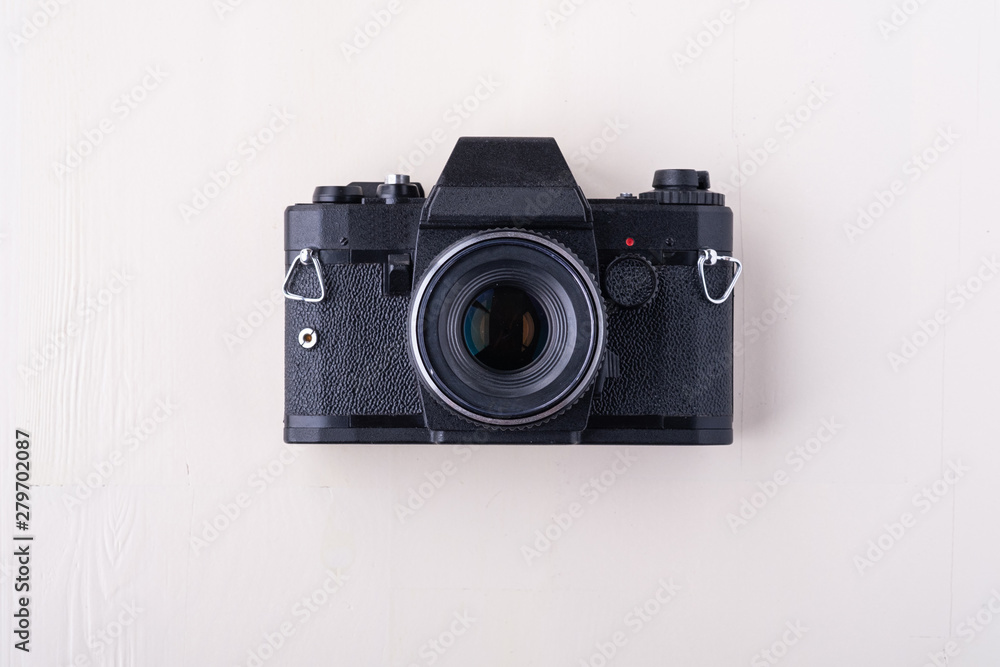 Old vintage retro single black photo film camera copy space top view flat lay on white background