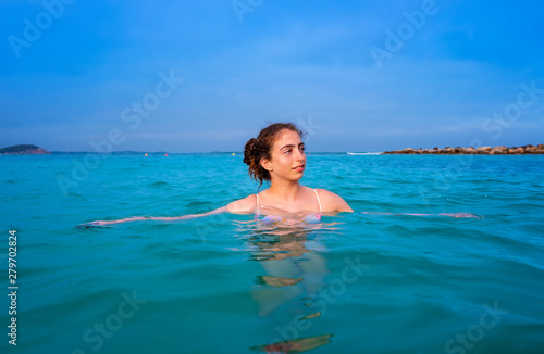 Young woman girl bath in the Ibiza beach