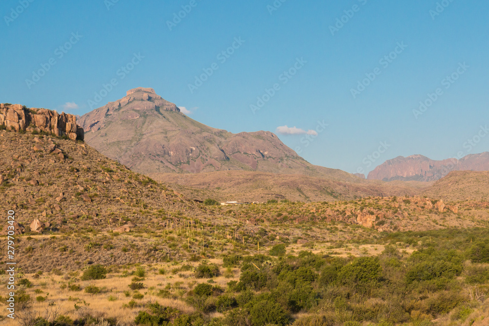 Desert landscape view of the Chisos Basin during the day in Big Bend National Park (Texas). Desert landscape view of the Chisos Basin during the day in Big Bend National Park (Texas).