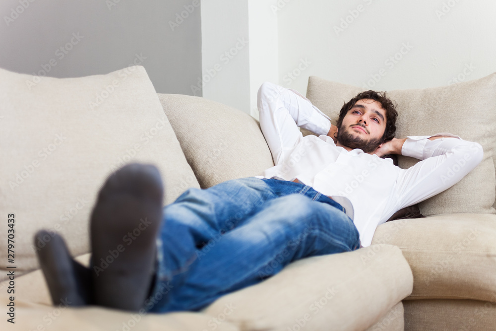 Man relaxing on his sofa Man relaxing on his sofa