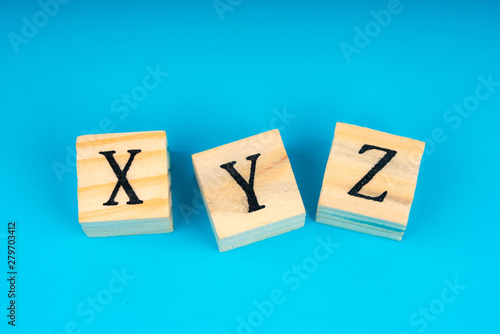 xyz letters written on wooden cubes photo