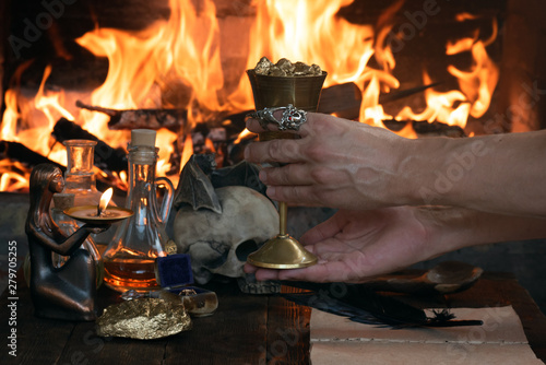 Slika na platnu Alchemist is working at his magic table and producing a gold.