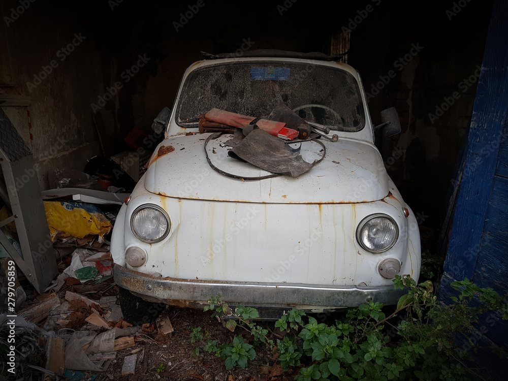 Old abandoned car, white Fiat 500