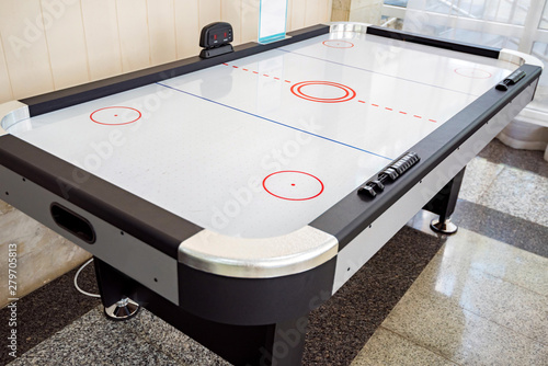 Close up empty air hockey table for playing indoors photo