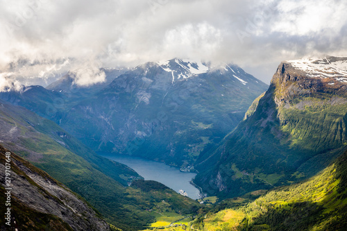 View to the Geiranger fjord with green valley surrounded by mountains, Geiranger, Sunnmore region, More og Romsdal county, Norway