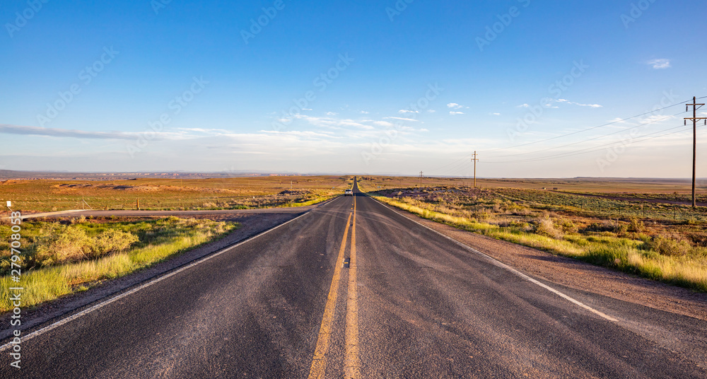 Long highway in the american desert, blue sky