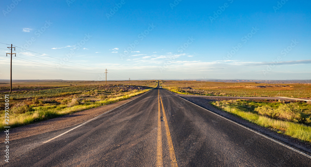 Long highway in the american desert, blue sky