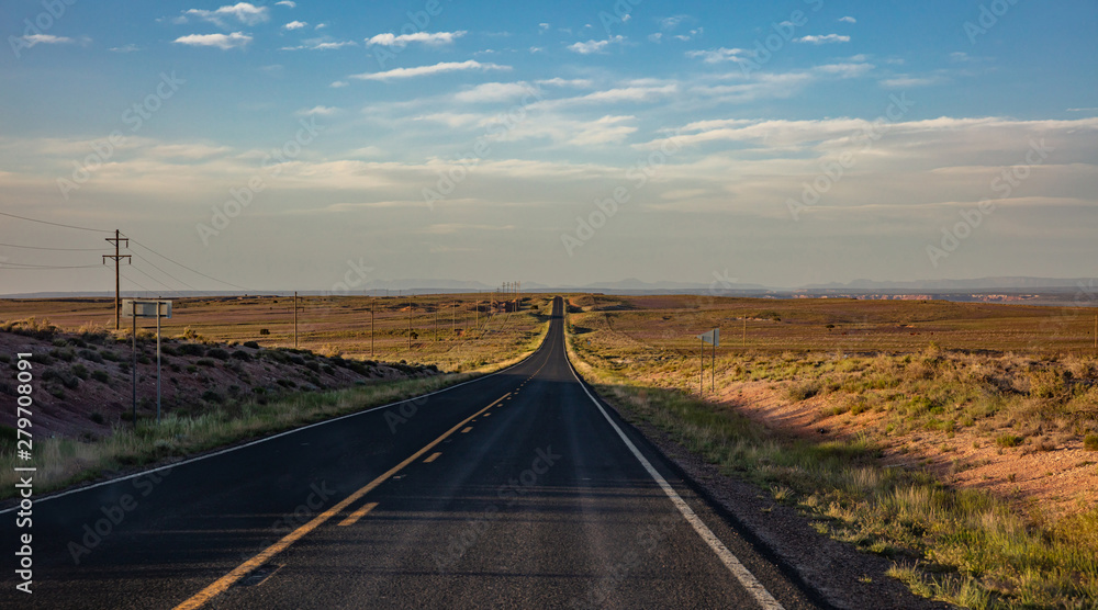 Long highway in the american desert, blue sky