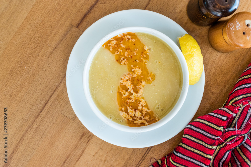 Turkish Lentil Soup with fried butter sauce / Mercimek Corbasi at Restaurant. Turkish Lentil Soup with fried butter sauce / Mercimek Corbasi at Restaurant.