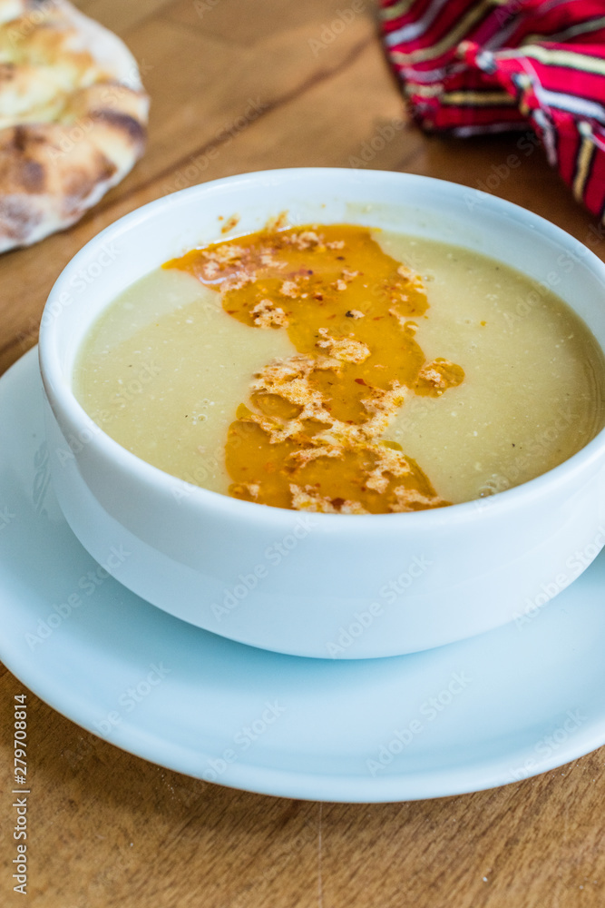 Turkish Lentil Soup with fried butter sauce / Mercimek Corbasi at Restaurant. Turkish Lentil Soup with fried butter sauce / Mercimek Corbasi at Restaurant.