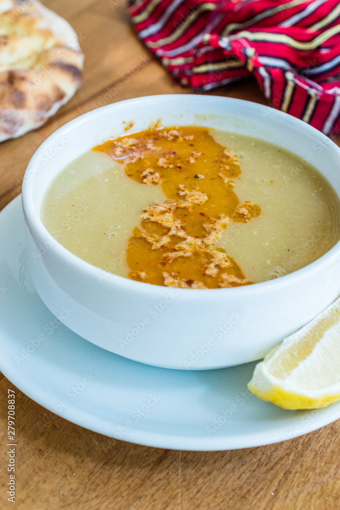 Turkish Lentil Soup with fried butter sauce / Mercimek Corbasi at Restaurant. Turkish Lentil Soup with fried butter sauce / Mercimek Corbasi at Restaurant.