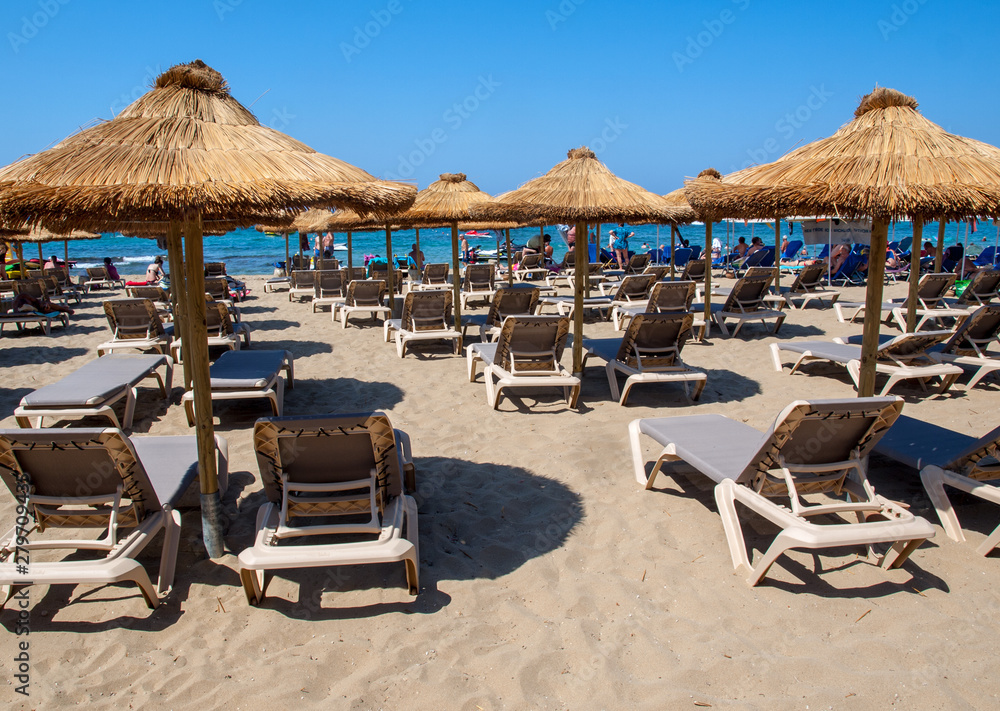  Sunbeds at the beach in Malia on Crete, Greece
