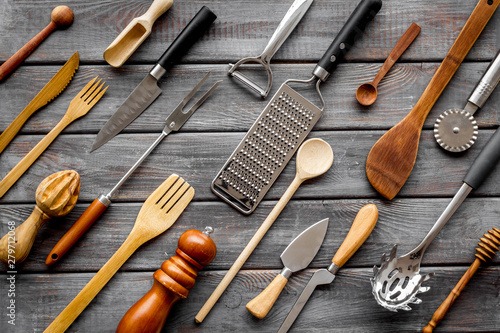 Pattern of cookware for chef work on wooden background top view