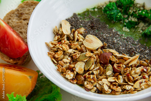 Green smoothie bowl with chia seeds and salted granola