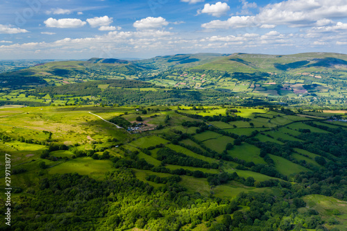 Aerial view of green fields and farmlands in rural Wales