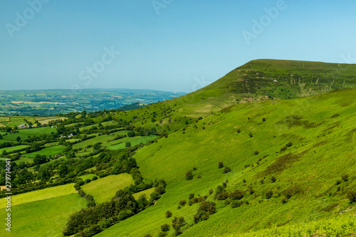 Aerial view of green fields and farmlands in rural Wales