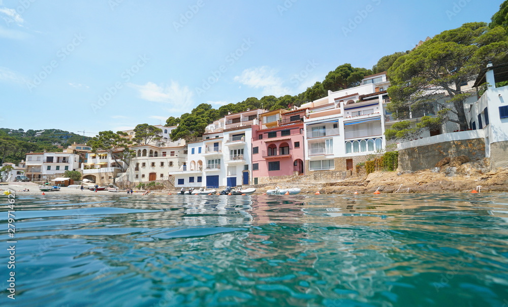 Waterfront of a beautiful Mediterranean village on the Costa Brava in Spain, seen from water surface, Sa Tuna, Begur, Catalonia