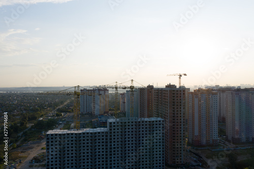 Beautiful urban construction site silhouettes at sunset