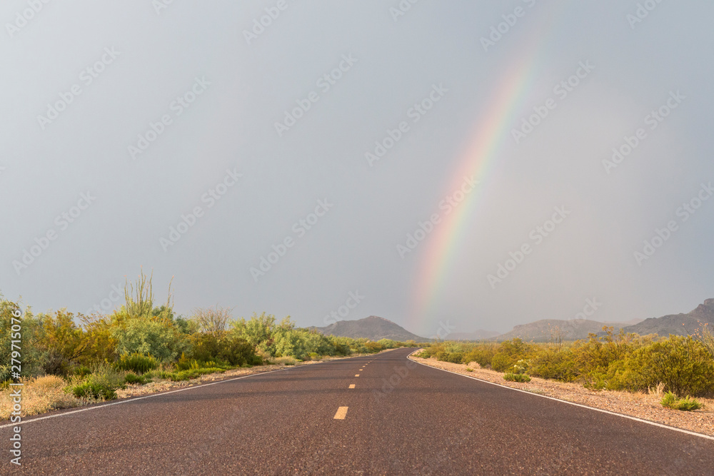 A rainbow forming over the landscape of Big Bend National Park after a thunderstorm in Texas.
