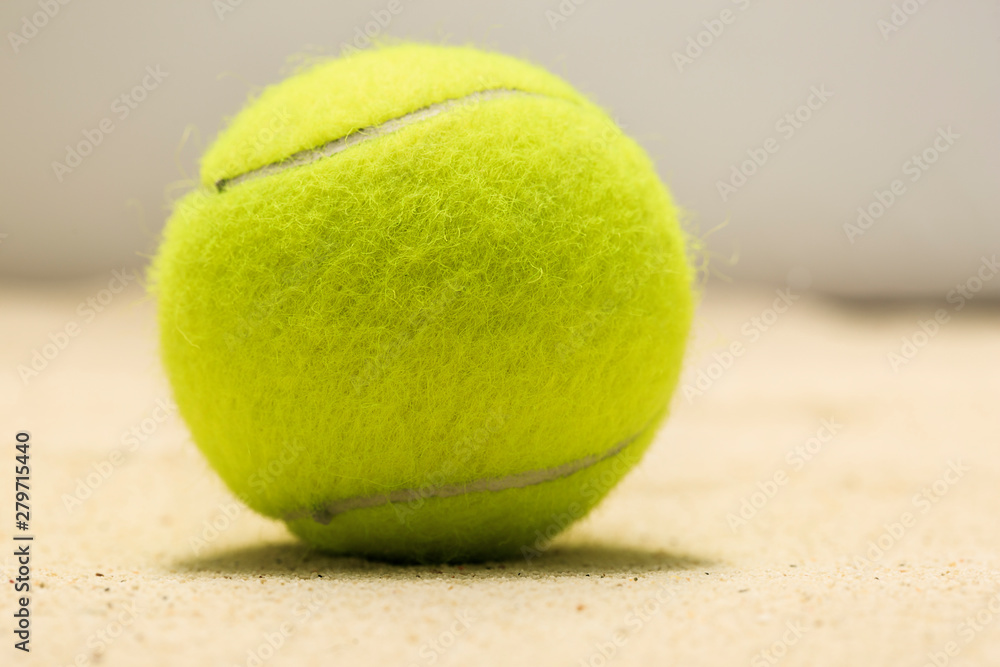Tennis ball in the sand