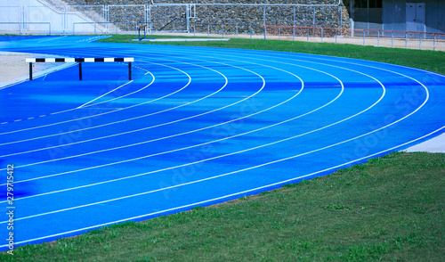 Blue athletic track in a stadium © photostocklight
