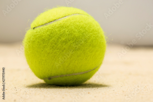 Tennis ball in the sand © photostocklight